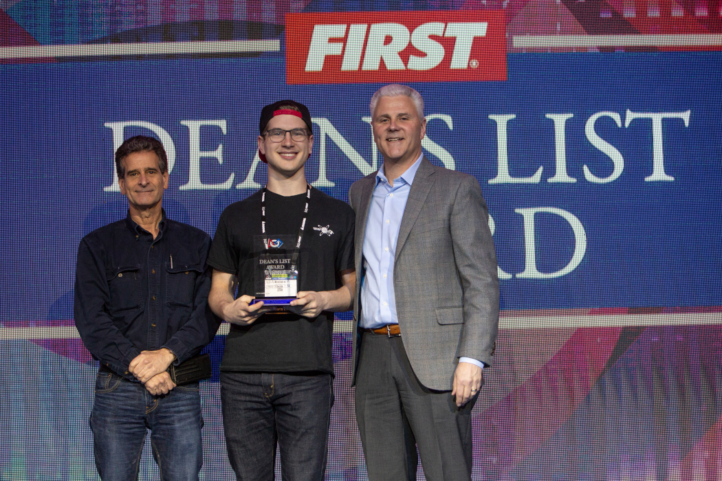 Erik Boesen being awarded the Dean's List Award by FIRST founder Dean Kamen.