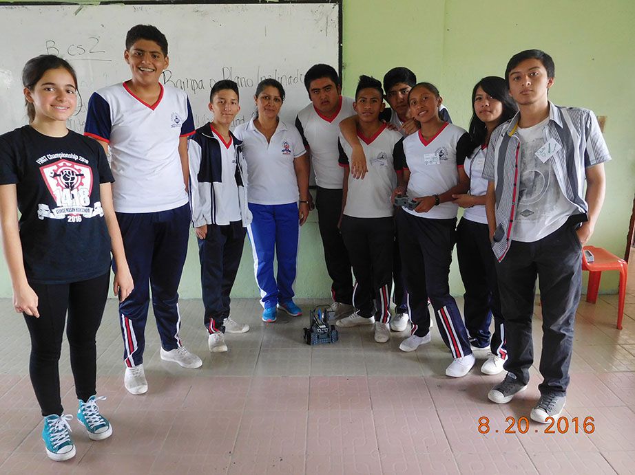 A team member posing with San Miguel de los Bancos high schoolers.