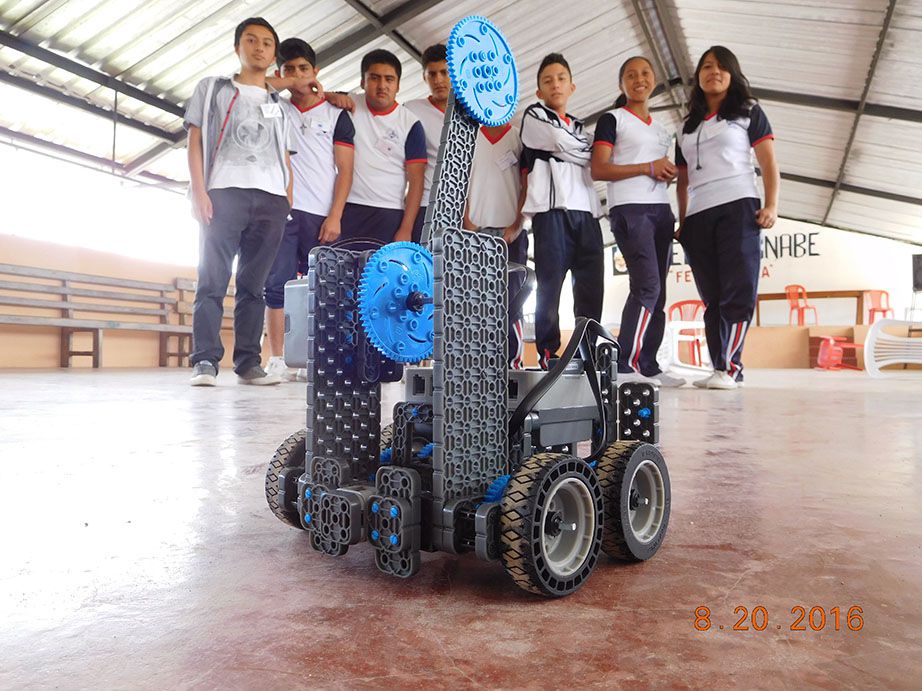 San Miguel de los Bancos students posing behind their finished robot.