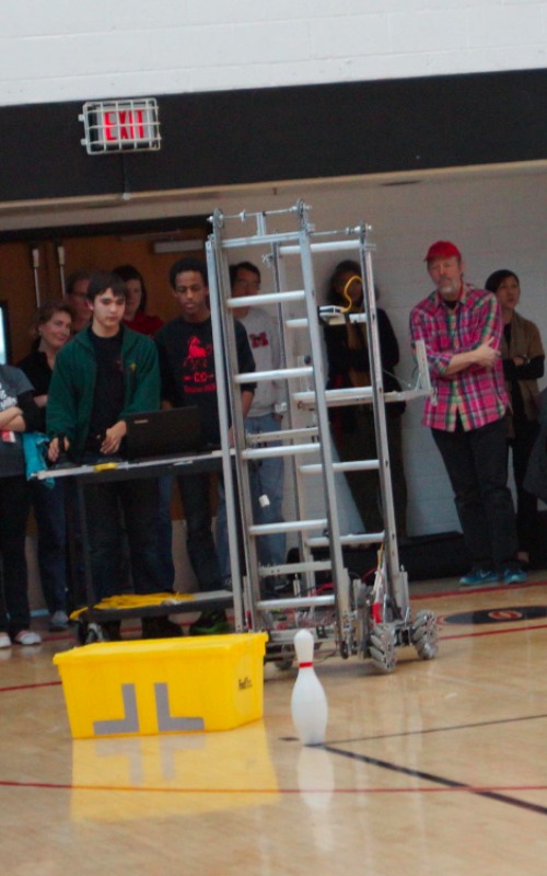 The 2015 robot with two boxes and a bowling pin.