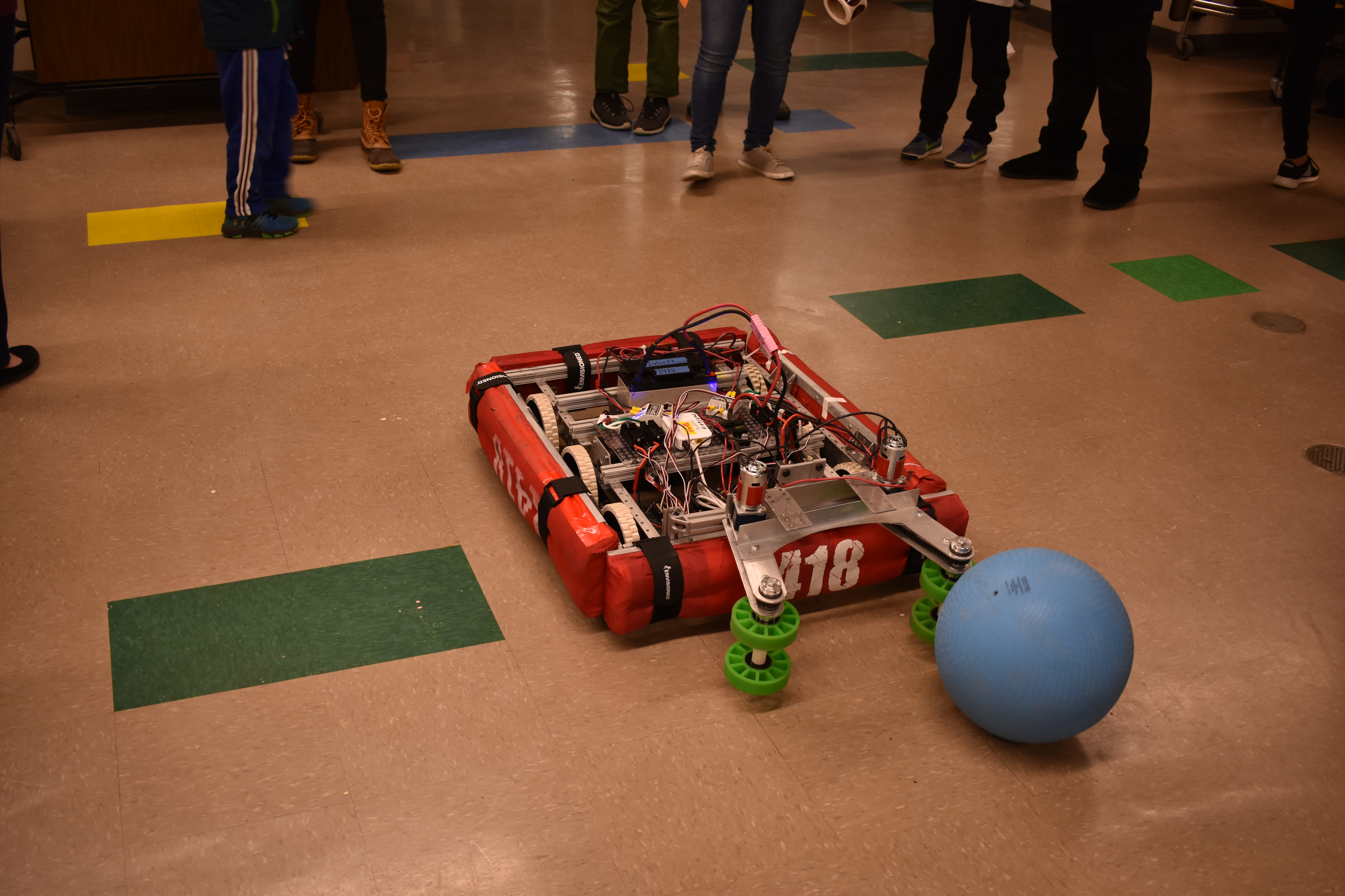 The robot picking up a ball.