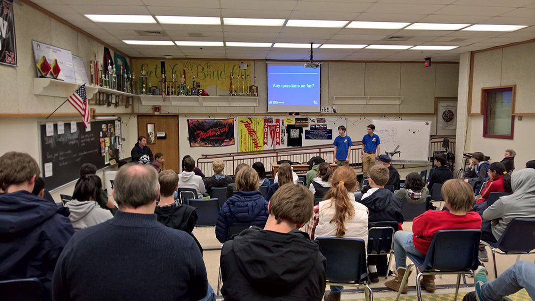 Students attending a 2016 workshop in a large classroom.