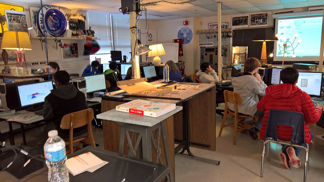 Students attending a 2016 workshop in a small classroom.