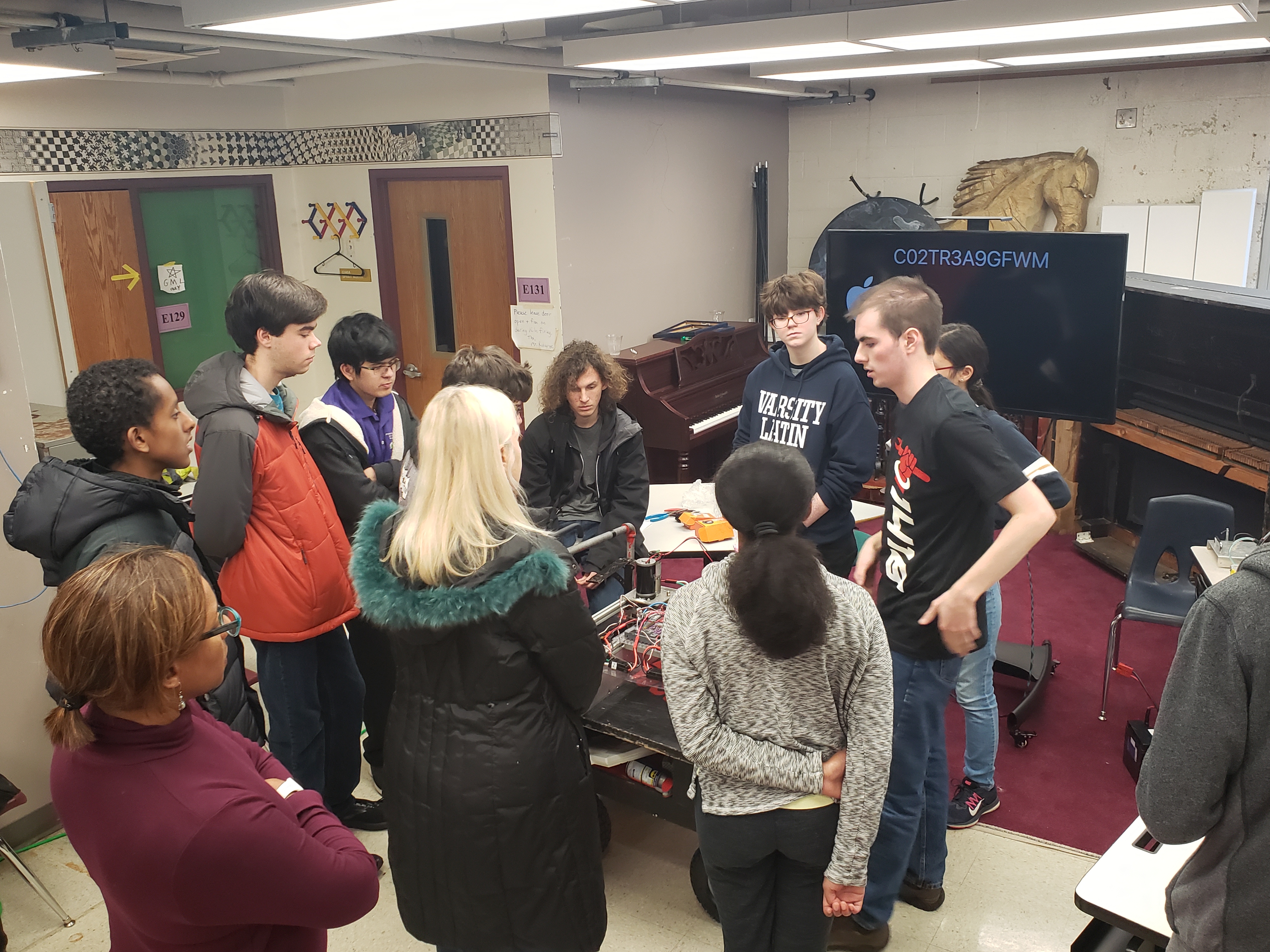 Students attending a 2019 workshop in a drivetrain discussion.