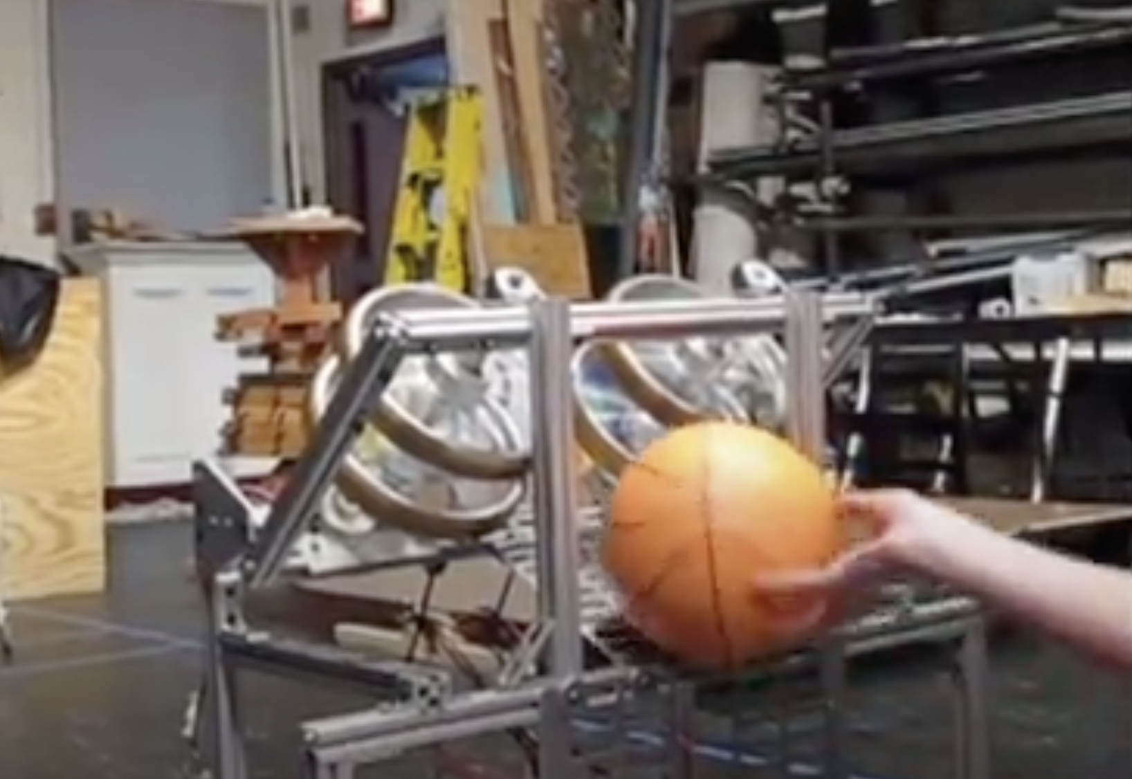 The 2013 robot about to launch a basketball.